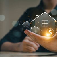 Real estate concept business, home insurance and real estate protection. Real estate investment concept. Buy and sell houses and real estate online on a virtual screen.